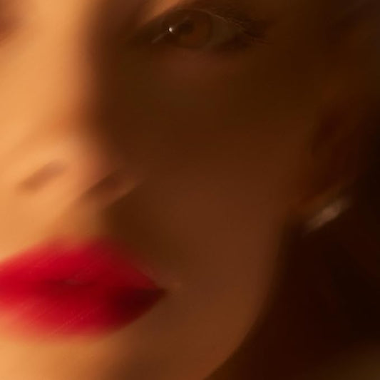 This image features the artistically blurred cover of the "Ariana Grande eternal sunshine CD." The cover art is intentionally fuzzy, emphasizing the artist's name, Ariana Grande, in a subtle and stylish font.