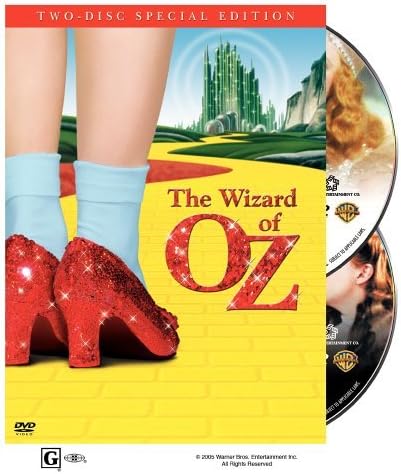 The Wizard of Oz two-disc special edition DVD set, showing the front cover with red glitter high heels and blue socks against a yellow brick road background, with two DVDs partially visible on the right.