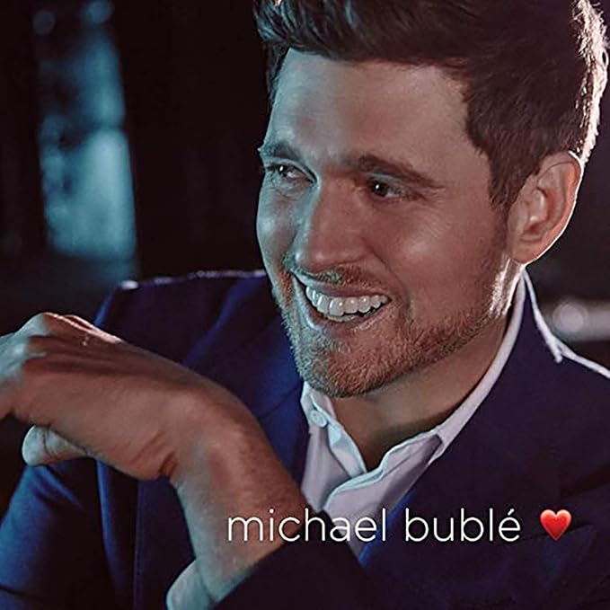 Man in a suit with 'Michael Bublé' text and heart emoji