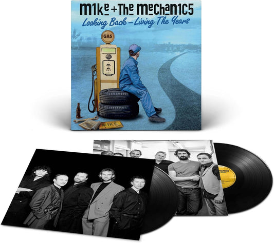 Vinyl record set with cover featuring a person sitting on a tire next to a gas pump.
