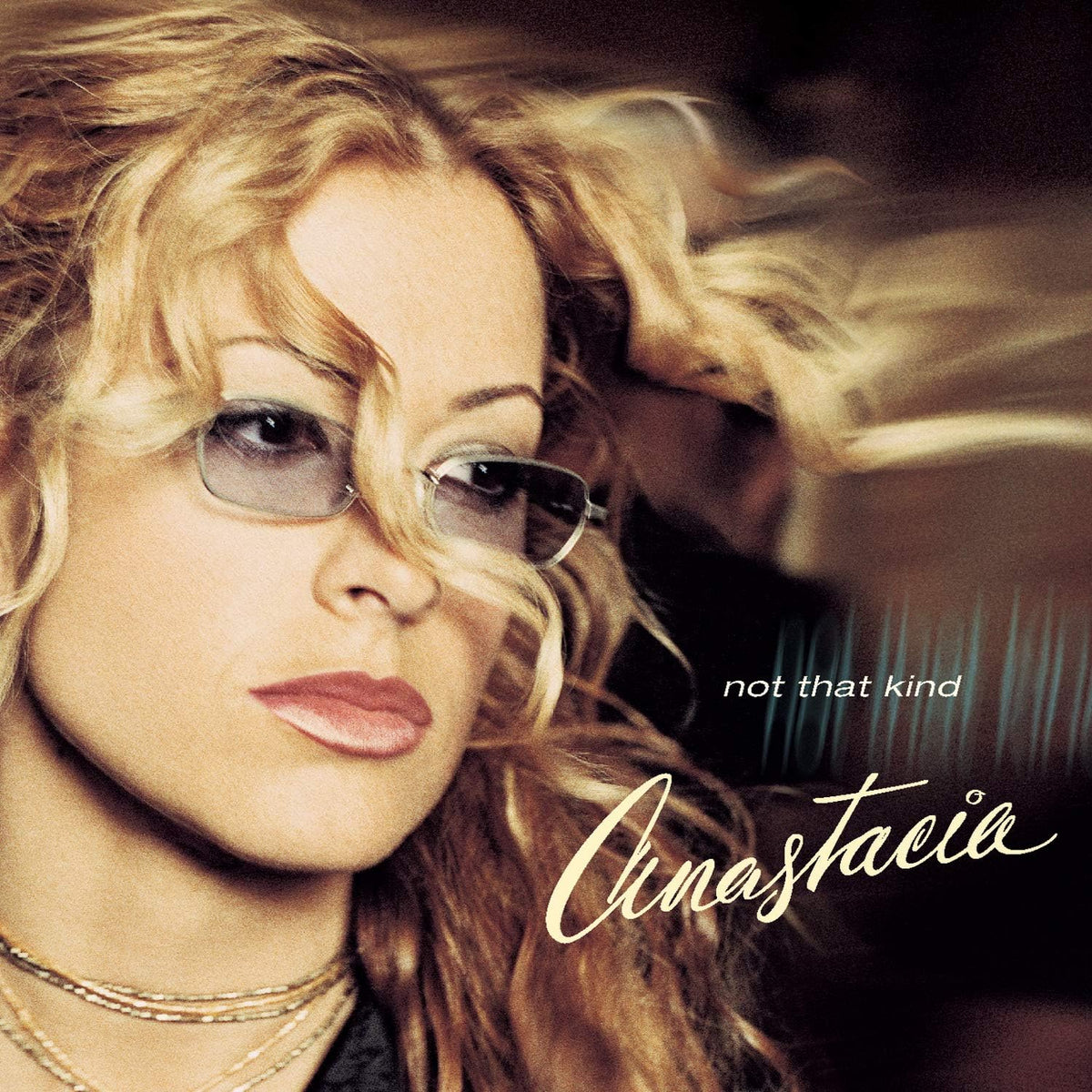 Album cover with a woman's face and the text 'not that kind' and 'Cinastacia'.