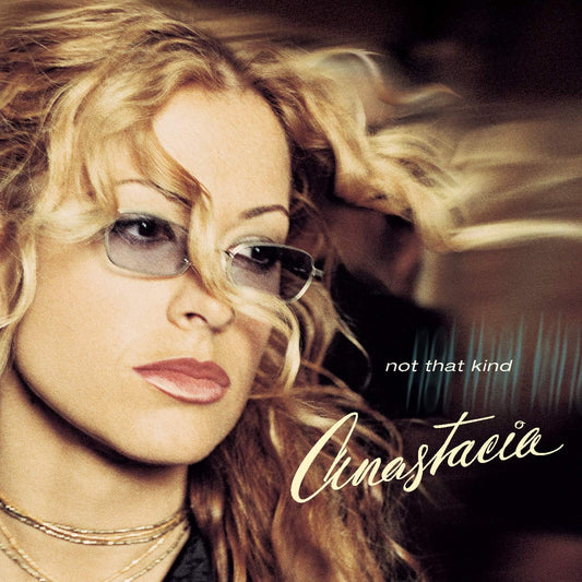 Album cover with a woman's face and the text 'not that kind' and 'Cinastacia'.