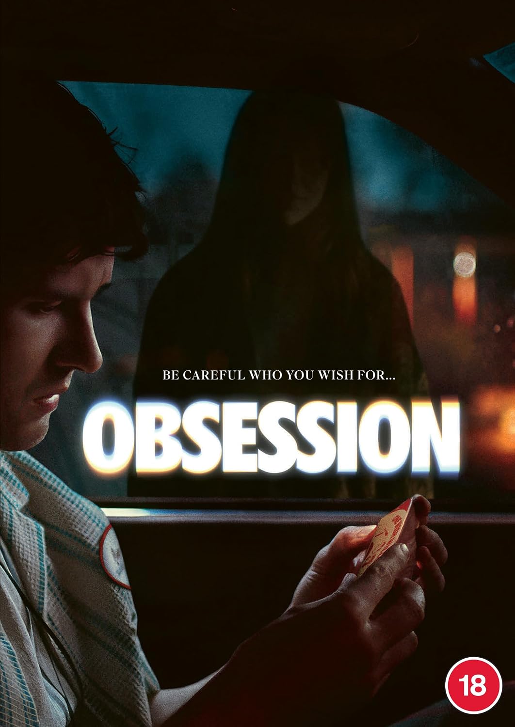 Movie poster for 'Obsession' featuring a man in a car looking at a phone, with a dark hooded figure reflected in the window behind him. Large glowing title text reads 'OBSESSION' with the tagline 'BE CAREFUL WHO YOU WISH FOR.