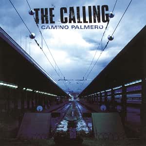 Album cover for 'The Calling - Camino Palmero' featuring a long train station platform under a cloudy blue sky, with the band's name and album title in bold text at the top.
