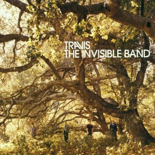 CD cover art featuring members of the band Travis, with a background of a forest.