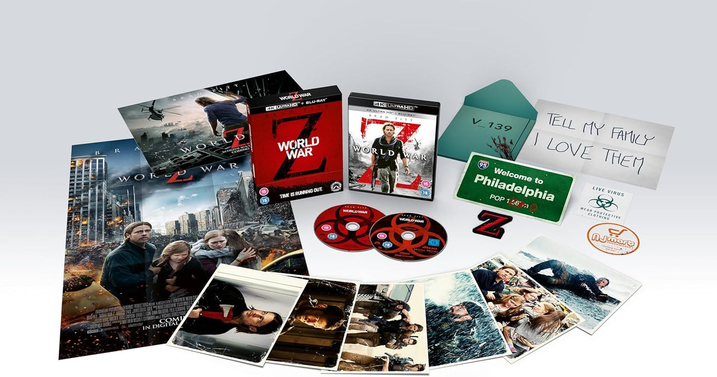 A collection of World War Z 4K UHD Blu-ray discs and various collector's items including a fold-out theatrical poster, a fold-out theatrical quad, art cards, and a reproduction 'Gerry's note to family'.