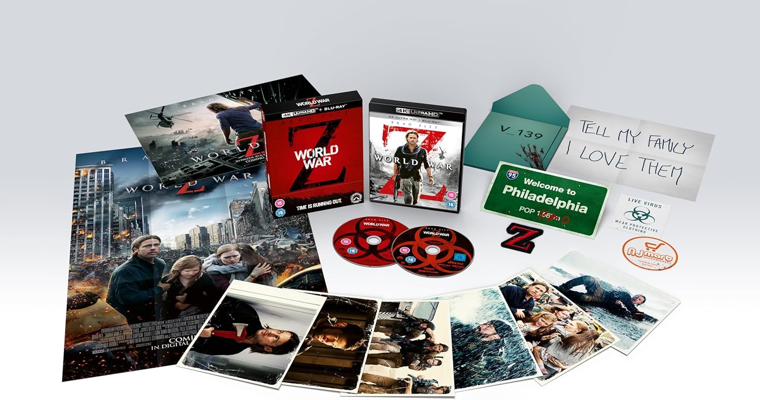 A collection of World War Z 4K UHD Blu-ray discs and various collector's items including a fold-out theatrical poster, a fold-out theatrical quad, art cards, and a reproduction 'Gerry's note to family'.
