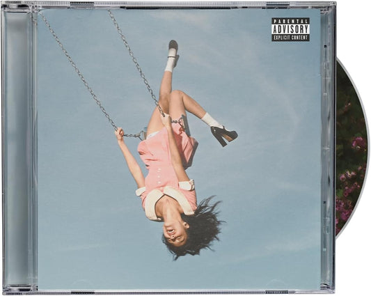 CD cover with a person on a swing against a blue sky, featuring a 'Parental Advisory' label.