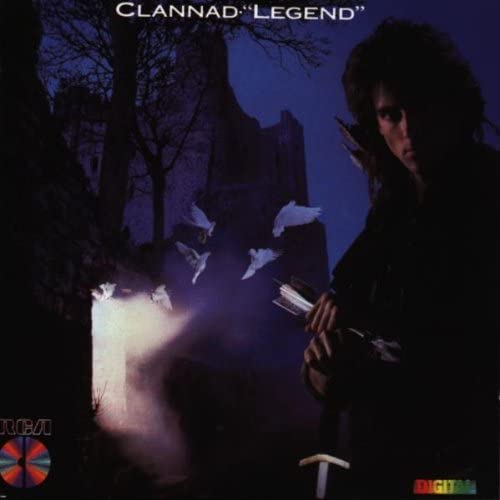 CD cover of 'Clannad' featuring a man in a black outfit with a sword, against a dark background with flying birds and a castle in the distance.