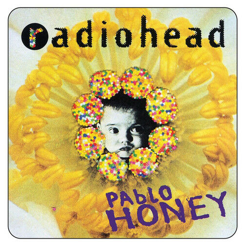 The cover art for 'Pablo Honey' by Radiohead featuring a colorful flower design with a young boy's face in the center.